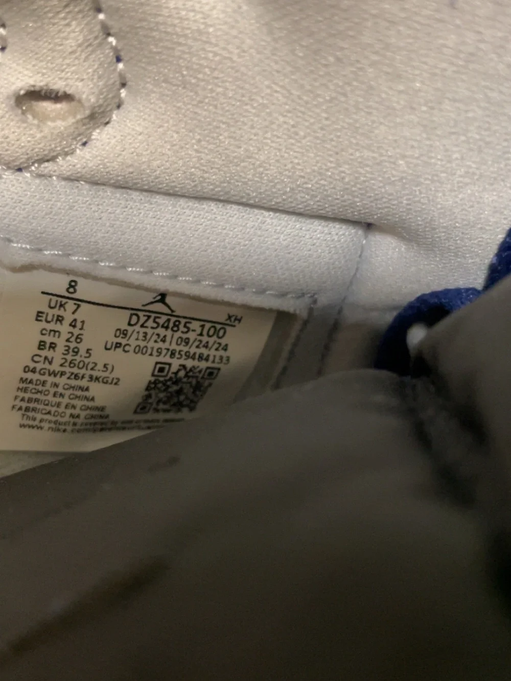 Nike Air Jordan 1 High in White and Blue with Black Swoosh
